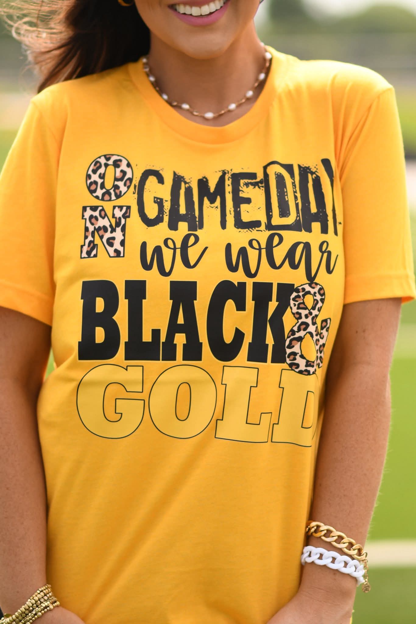 On Game Day we Wear Black & Gold Graphic Tee